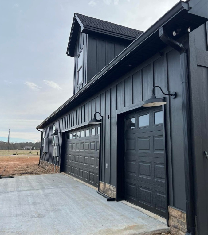 ProFlo gutter project on dark barn exterior