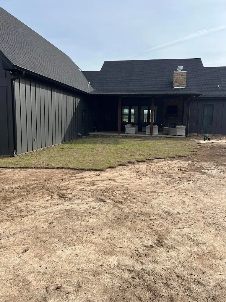 Gutters around a dark-sided home's courtyard