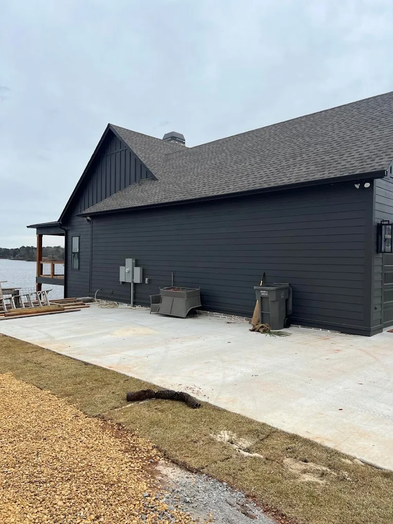 Dark gutters matching a charcoal home's side exterior