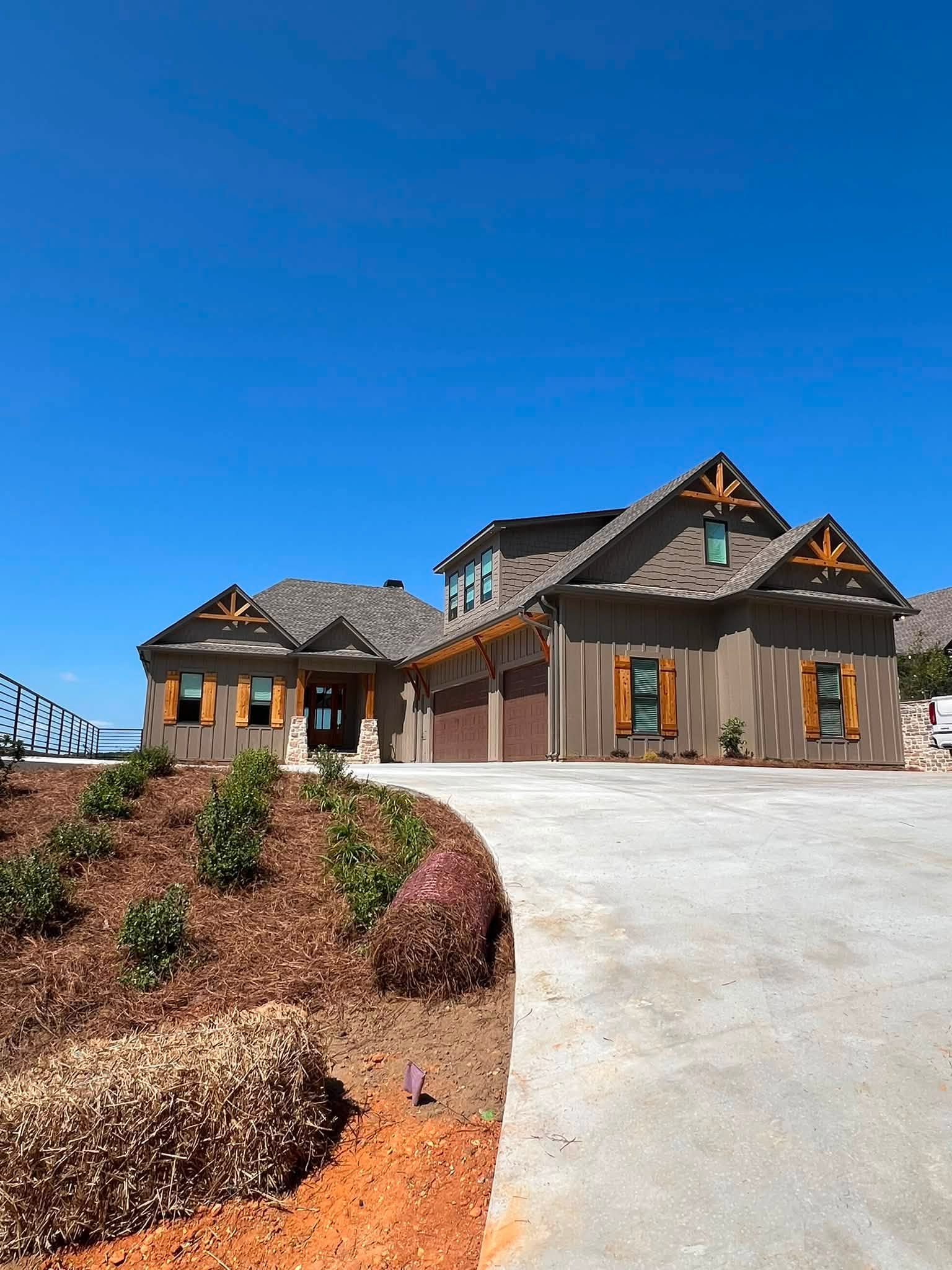 Gutters along the front rooflines of a lakeside home