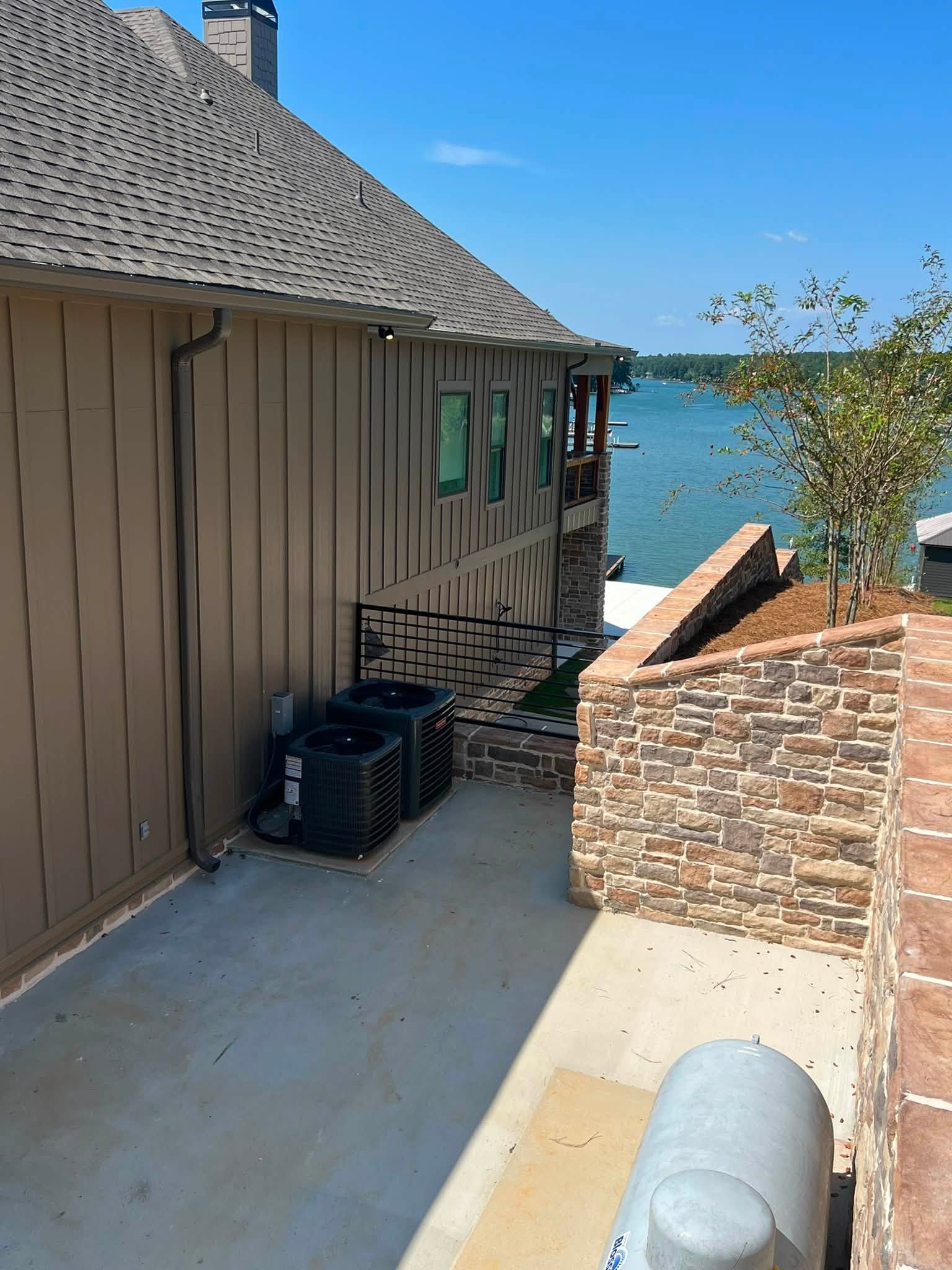 Downspout along the side of a lakeside home